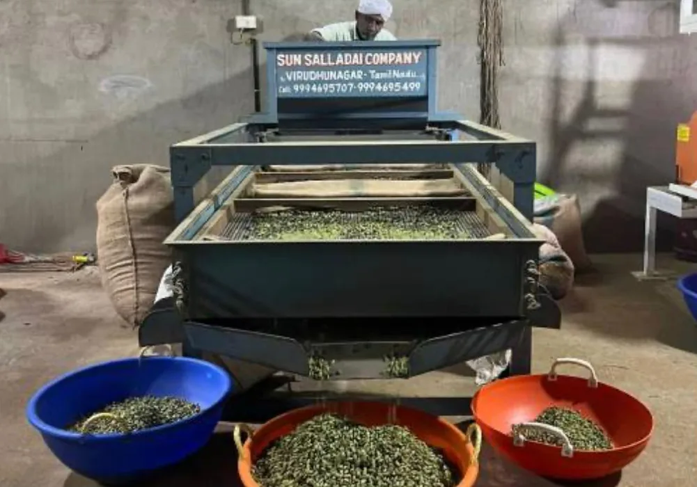Cardamom grading machine sorting pods by size into bowls
